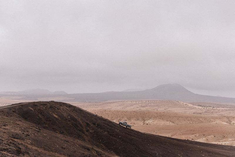 Empty desert ridges under a pale sky