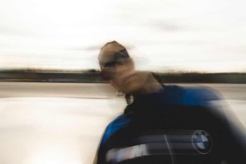 A rider on a BMW motorcycle dragged by a slow shutter