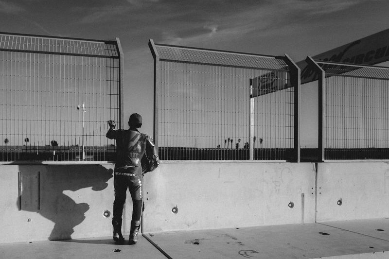 A figure at a concrete lookout fence