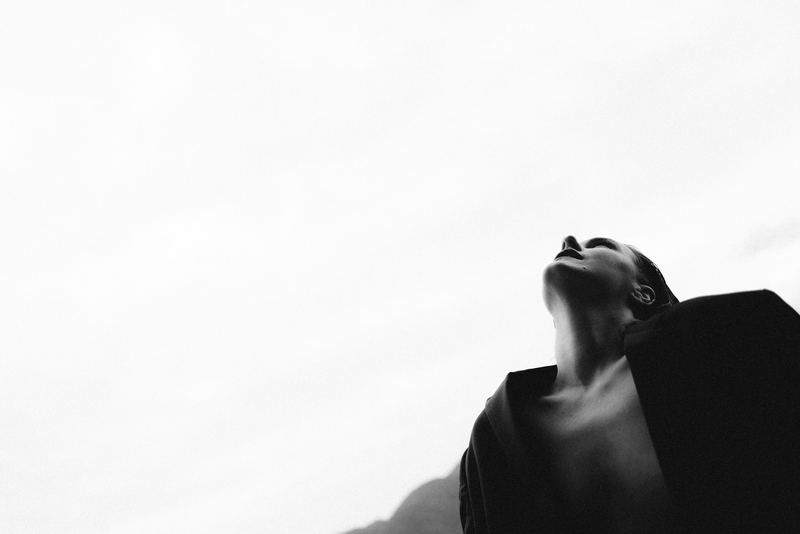 A hand raised against a bright white ground